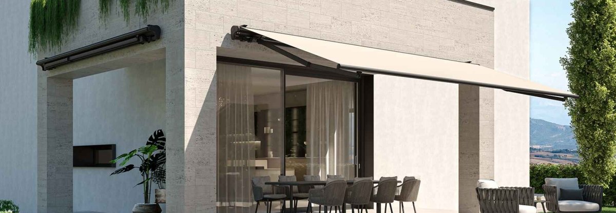 Motorized awning installed on modern house patio for outdoor shade and automation