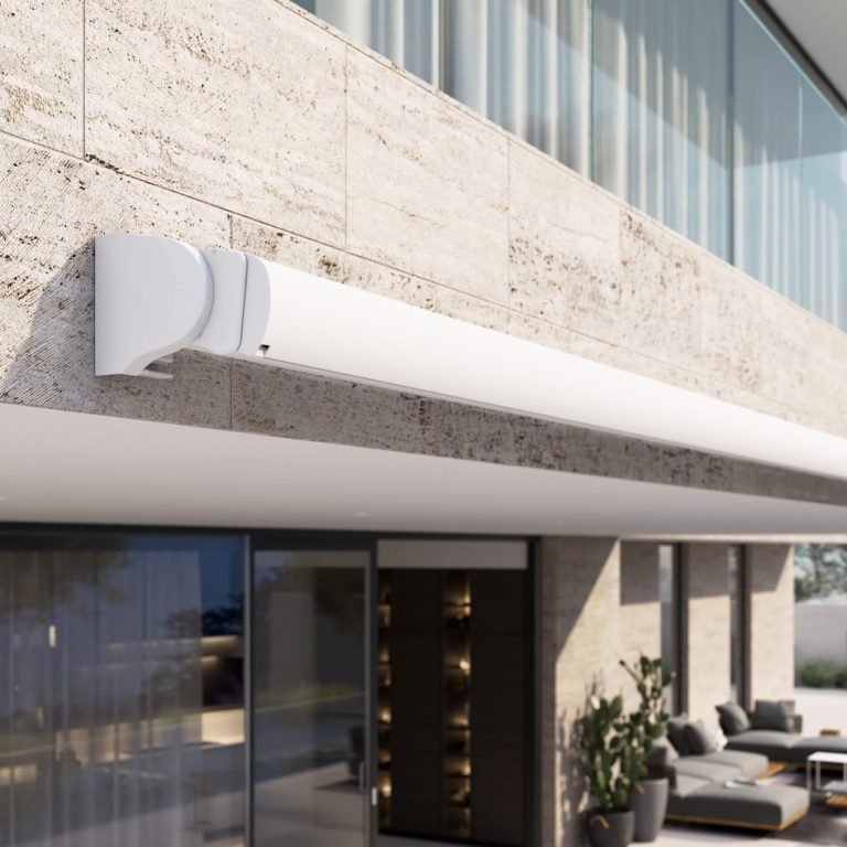 Retractable wall-mounted fabric canopy for patio sun protection