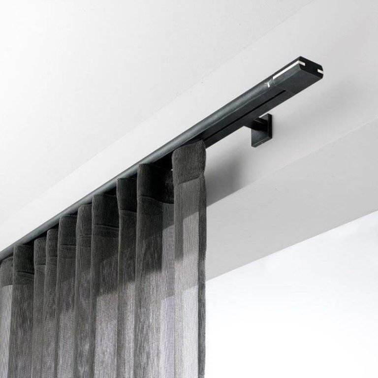 Modern black curtain rail track with grey sheer curtains wall mounted in contemporary interior