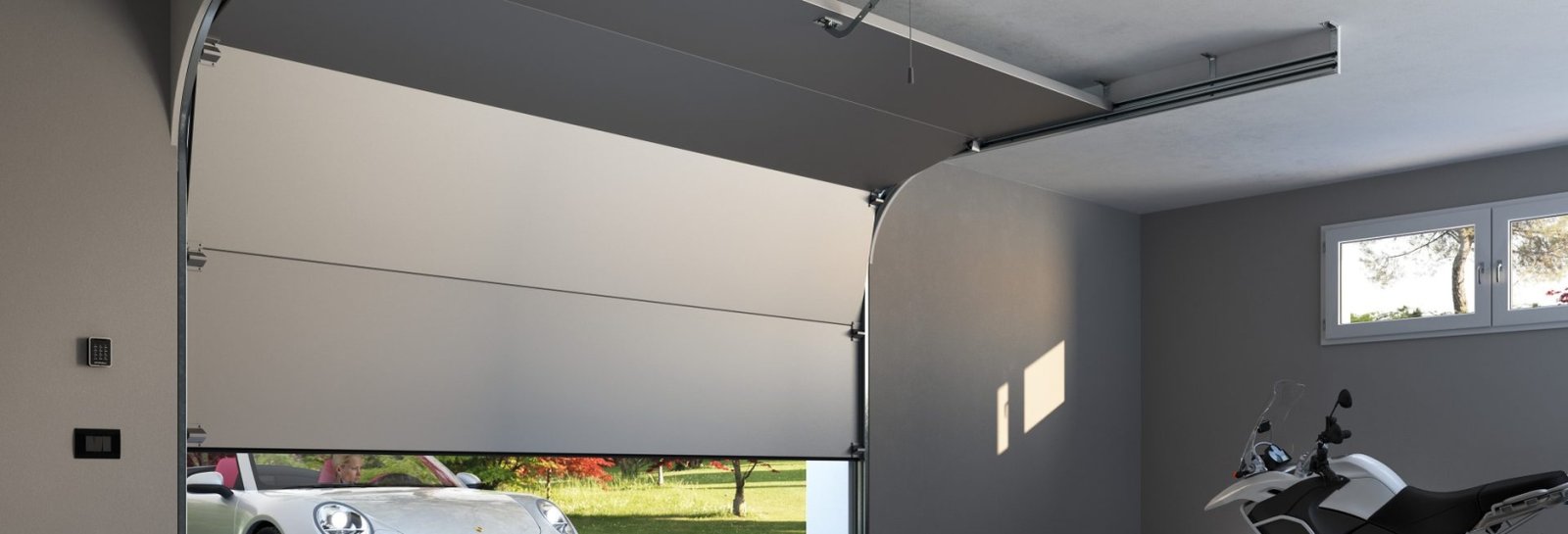 Modern automatic garage door with car parked inside a residential garage